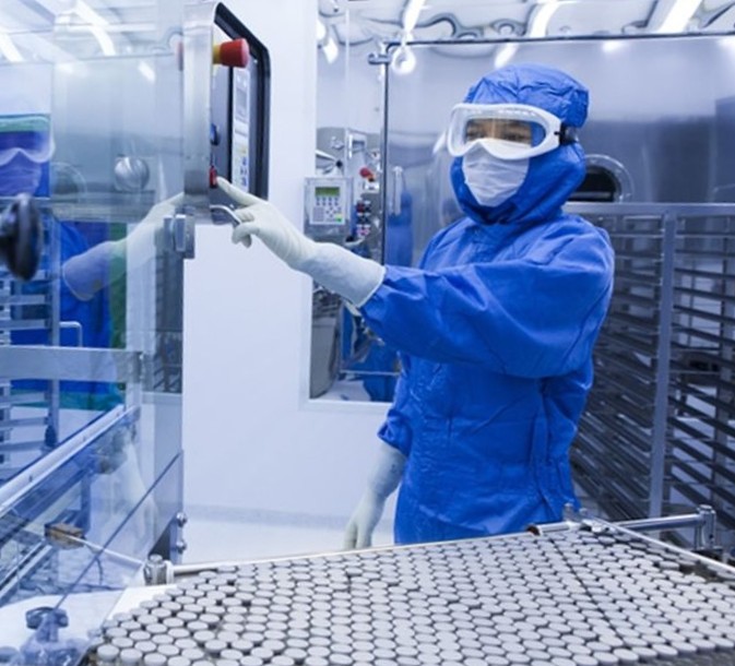 image of workers making prefilled syringes